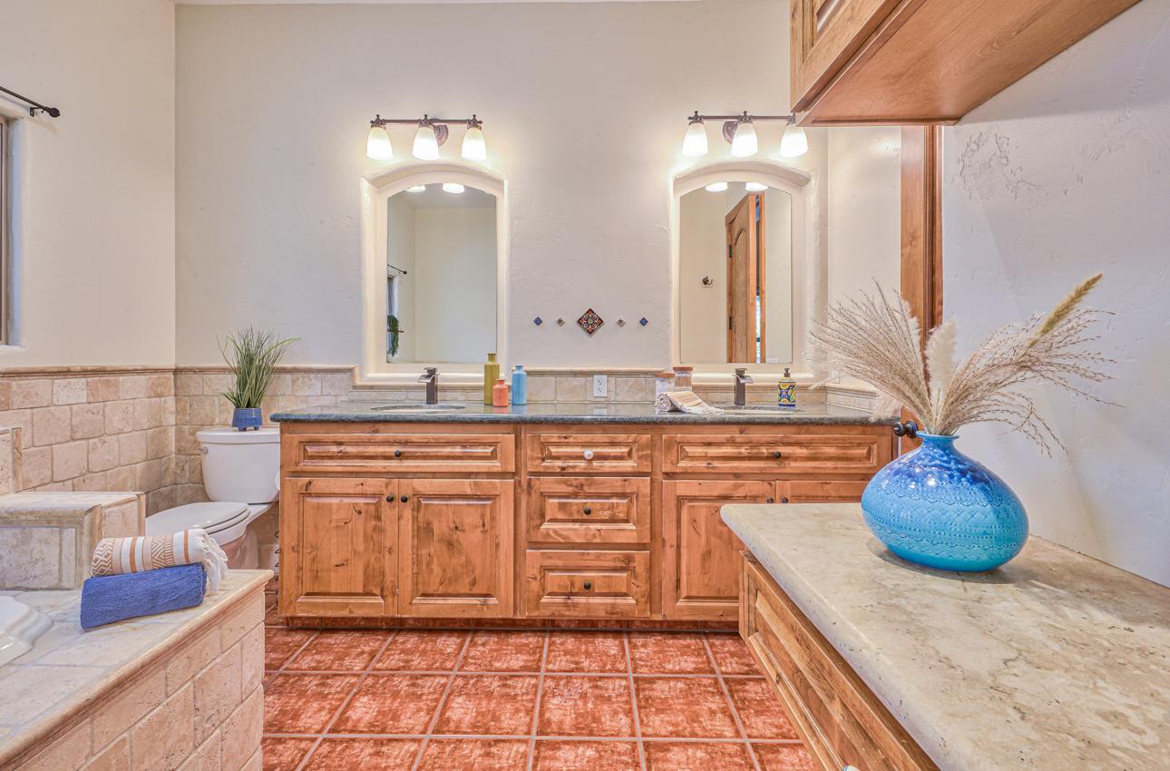 7382 Timeview Way Salinas, CA 93907 - Photo 66 of 79 a bathroom with a granite countertop sink and a mirror