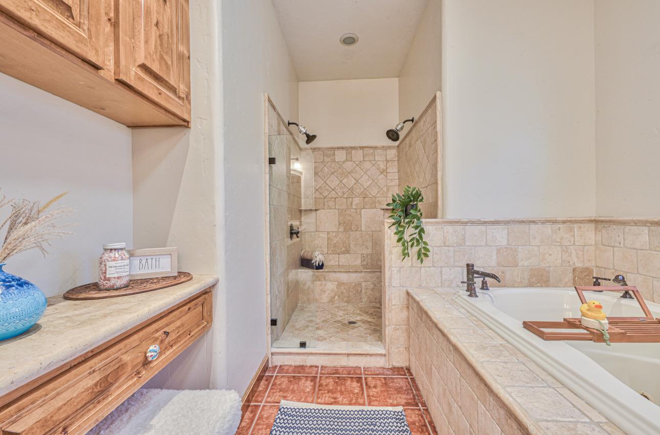 7382 Timeview Way Salinas, CA 93907 - Photo 68 of 79 a bathroom with a granite countertop double vanity sink a mirror and shower