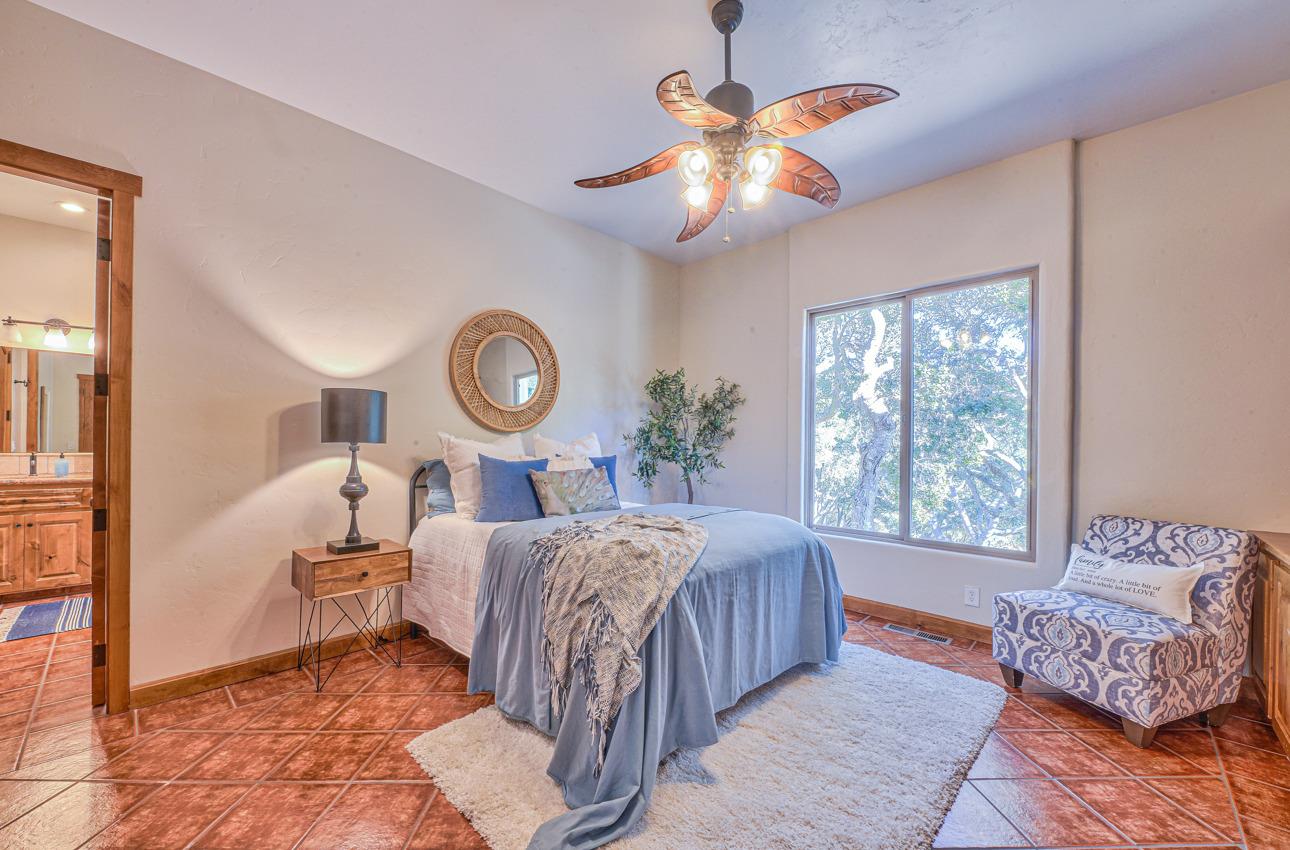 7382 Timeview Way Salinas, CA 93907 - Photo 73 of 79 a bed room with a bed and a chandelier