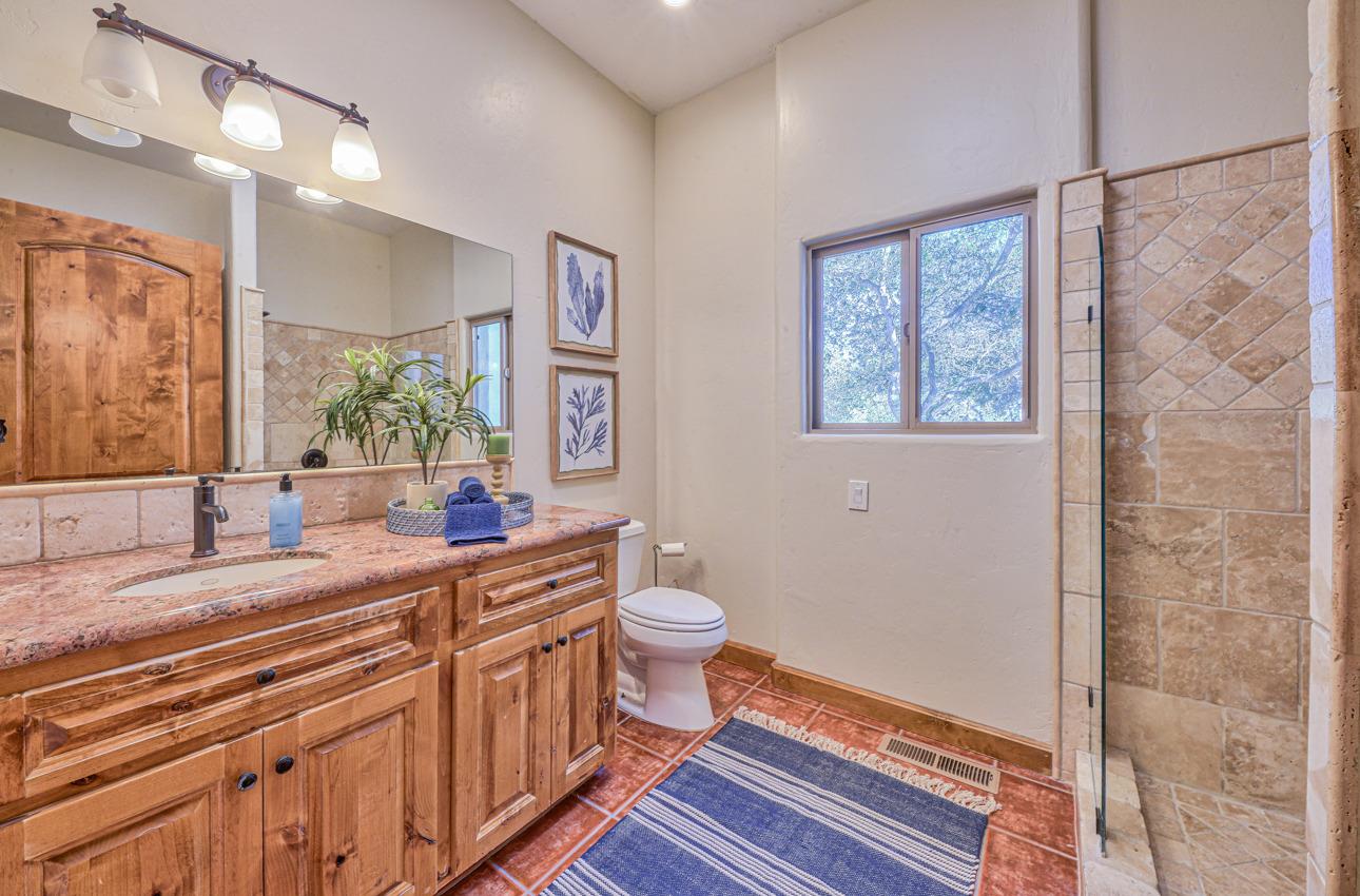 7382 Timeview Way Salinas, CA 93907 - Photo 75 of 79 a bathroom with a double vanity sink a mirror and a toilet