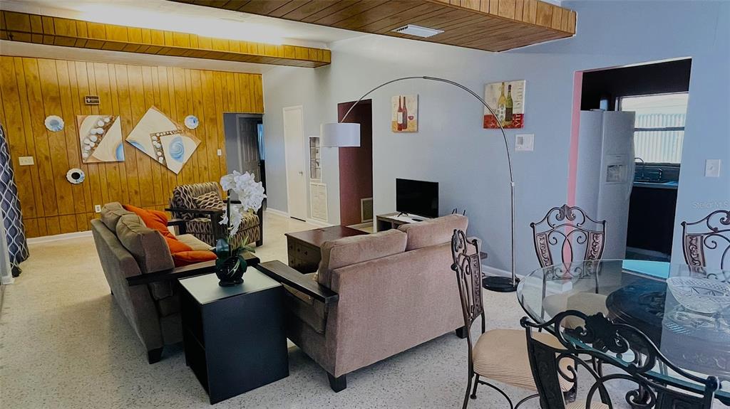 554 Lindley Terrace Port Charlotte, FL 33952 - Photo 11 of 57 a living room with furniture and a flat screen tv