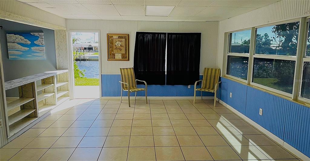 554 Lindley Terrace Port Charlotte, FL 33952 - Photo 16 of 57 a view of an entryway with wooden floor and windows