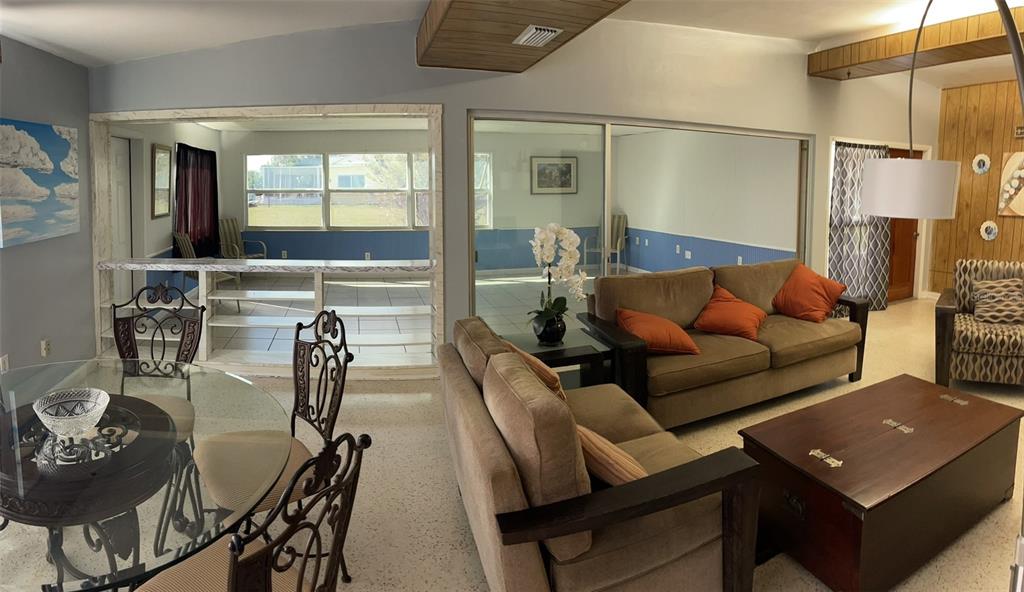 554 Lindley Terrace Port Charlotte, FL 33952 - Photo 20 of 57 a living room with furniture and a large window