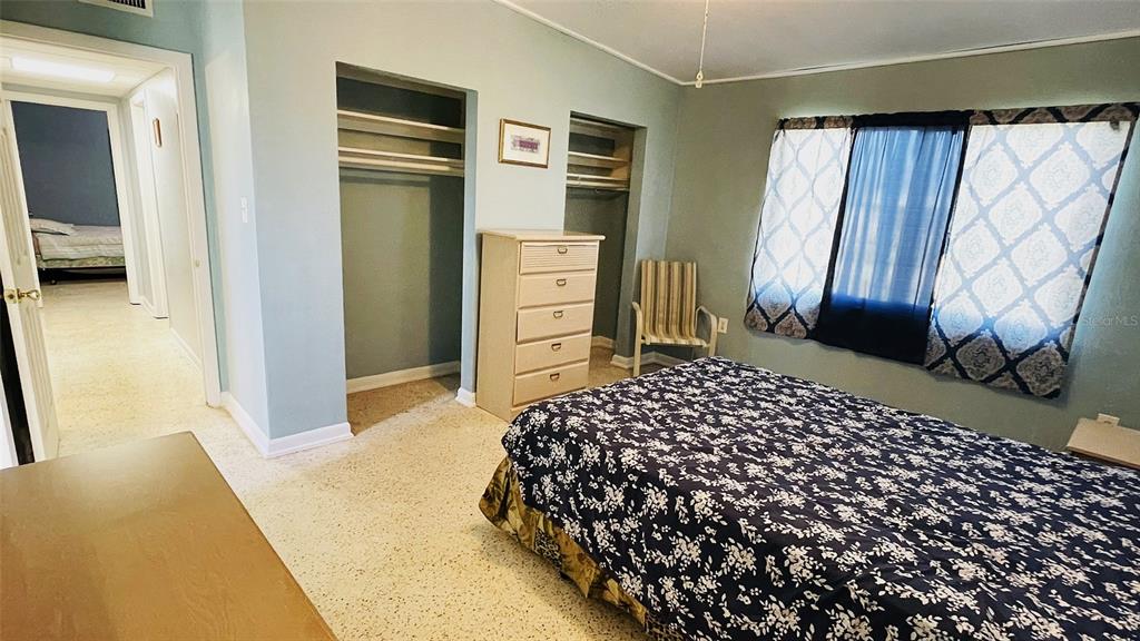 554 Lindley Terrace Port Charlotte, FL 33952 - Photo 23 of 57 a bedroom with bed and window