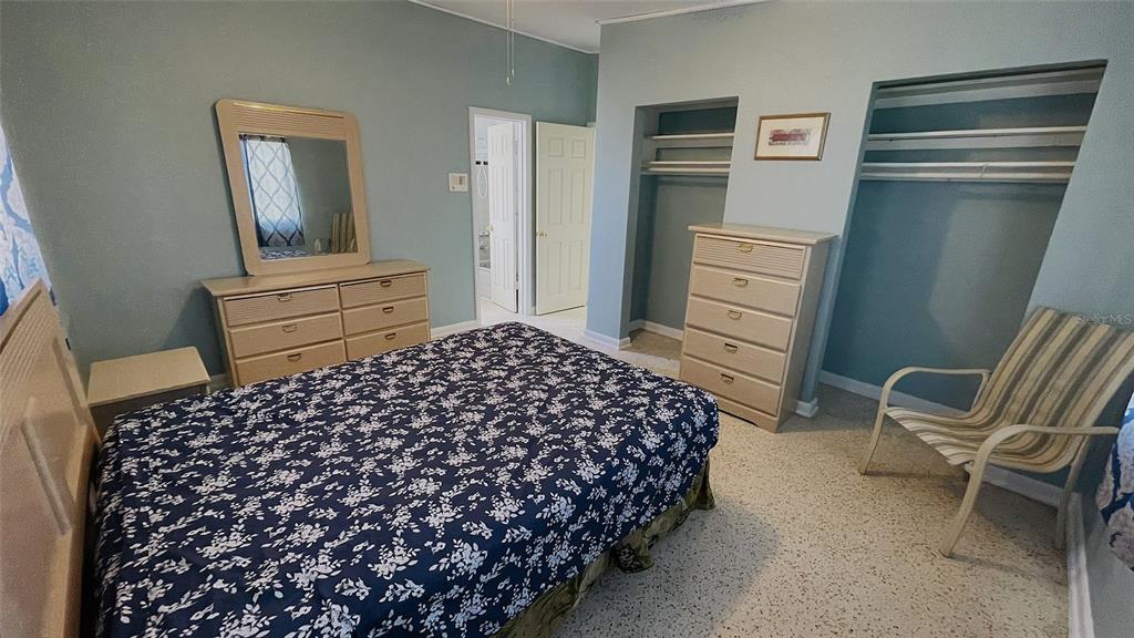 554 Lindley Terrace Port Charlotte, FL 33952 - Photo 24 of 57 a bedroom with a bed and chair