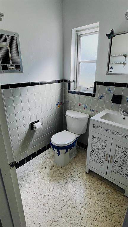 554 Lindley Terrace Port Charlotte, FL 33952 - Photo 26 of 57 a bathroom with a sink a toilet and mirror