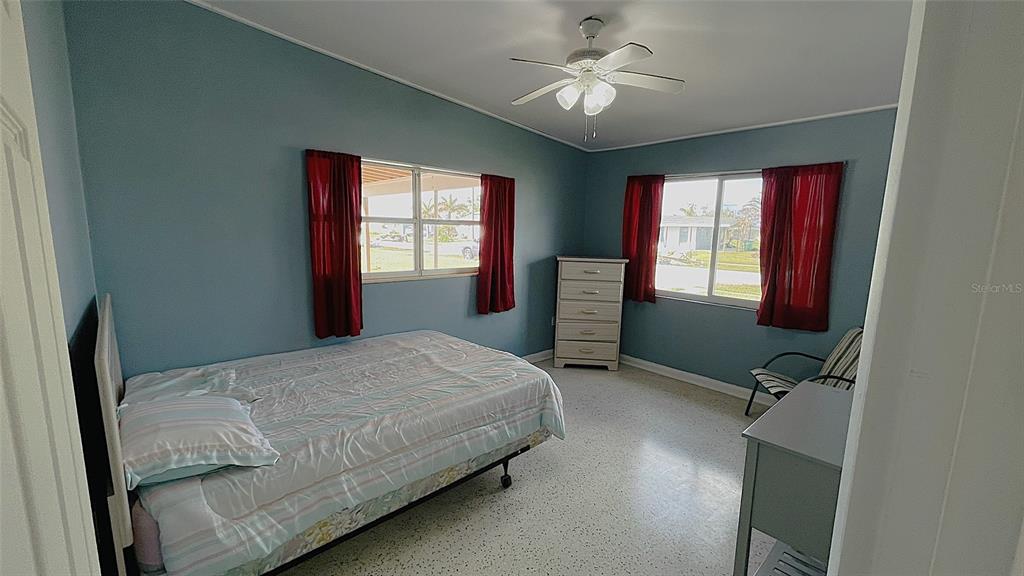 554 Lindley Terrace Port Charlotte, FL 33952 - Photo 28 of 57 a bedroom with a bed dresser and a window