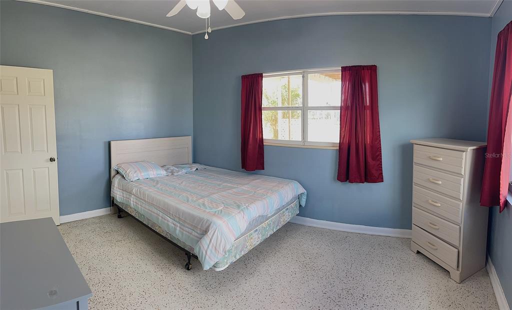 554 Lindley Terrace Port Charlotte, FL 33952 - Photo 29 of 57 a bedroom with a bed and a window