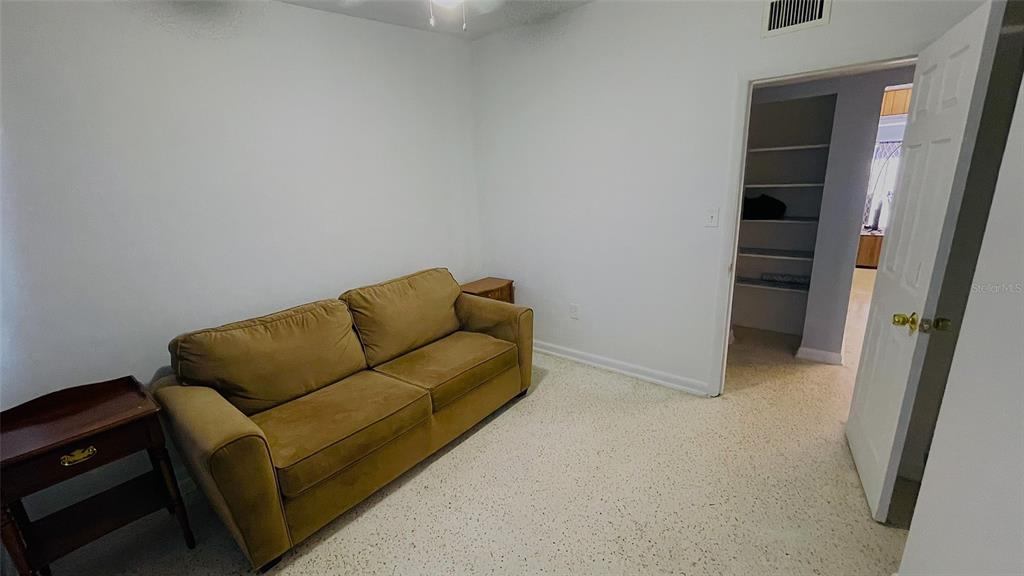 554 Lindley Terrace Port Charlotte, FL 33952 - Photo 34 of 57 a living room with furniture and a walk in closet