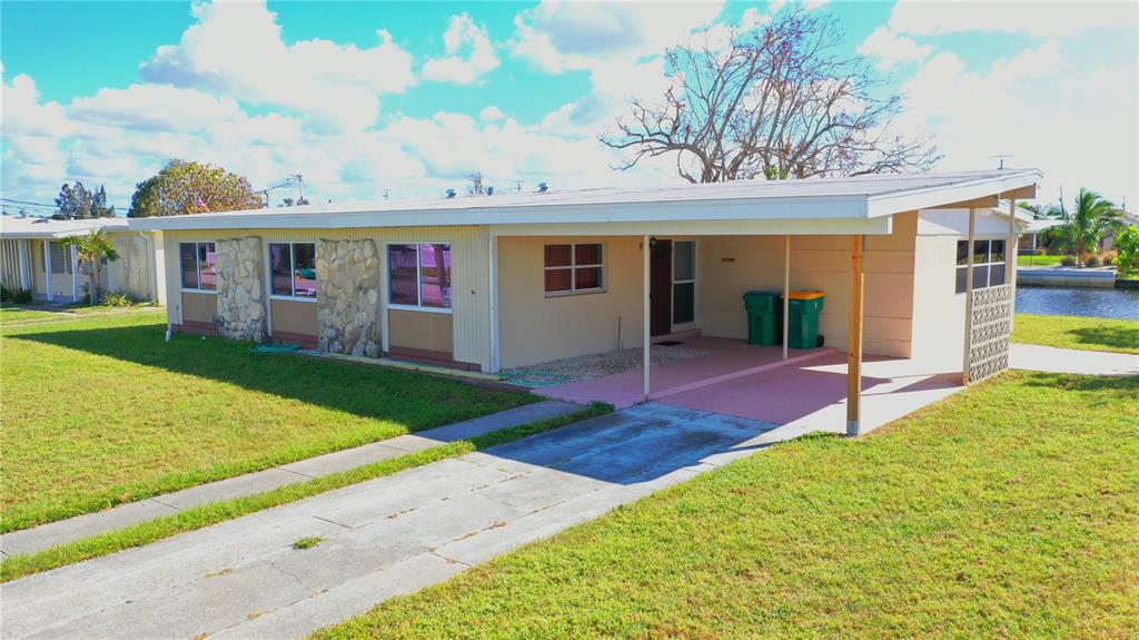 554 Lindley Terrace Port Charlotte, FL 33952 - Photo 41 of 57 a view of a yard with a patio