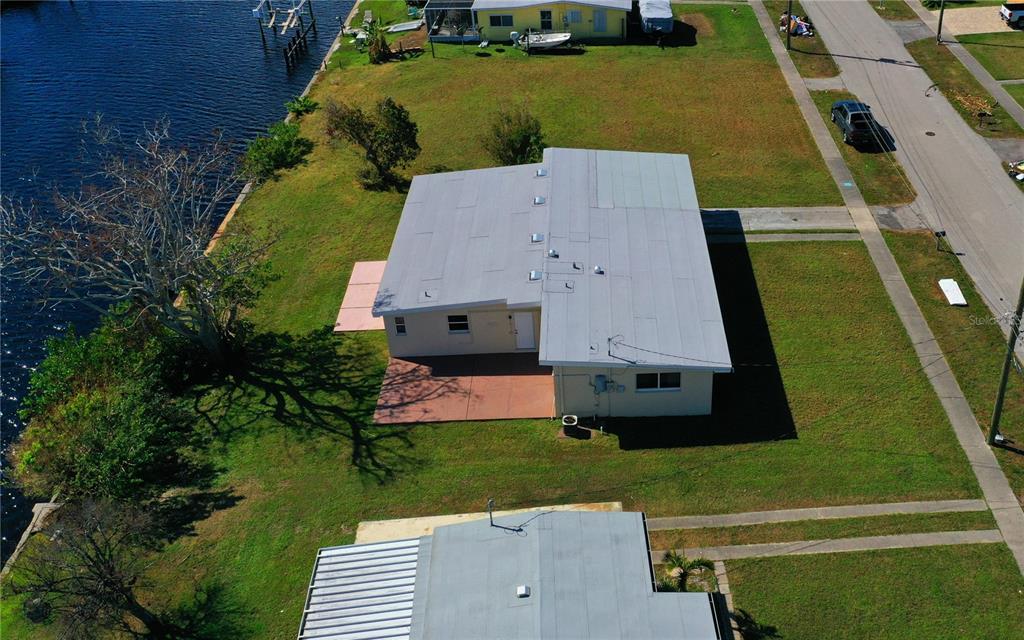 554 Lindley Terrace Port Charlotte, FL 33952 - Photo 46 of 57 an aerial view of a house with a garden