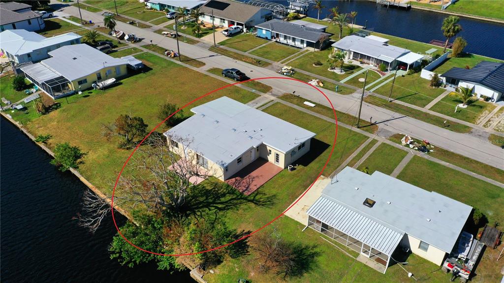 554 Lindley Terrace Port Charlotte, FL 33952 - Photo 48 of 57 an aerial view of a house with a garden
