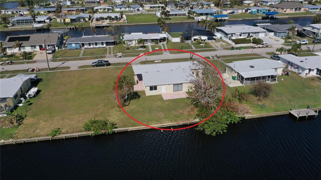 554 Lindley Terrace Port Charlotte, FL 33952 - Photo 49 of 57 an aerial view of a residential houses with outdoor space
