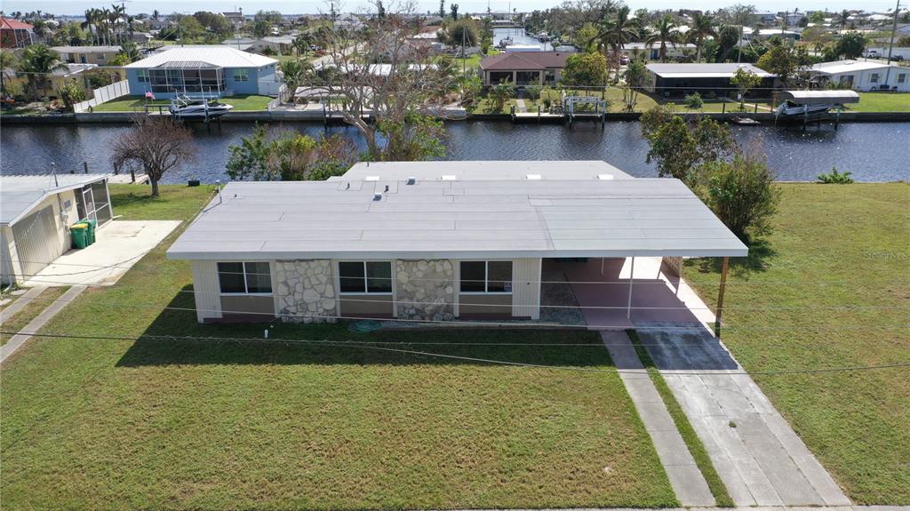 554 Lindley Terrace Port Charlotte, FL 33952 - Photo 5 of 57 an aerial view of a house with a lake view