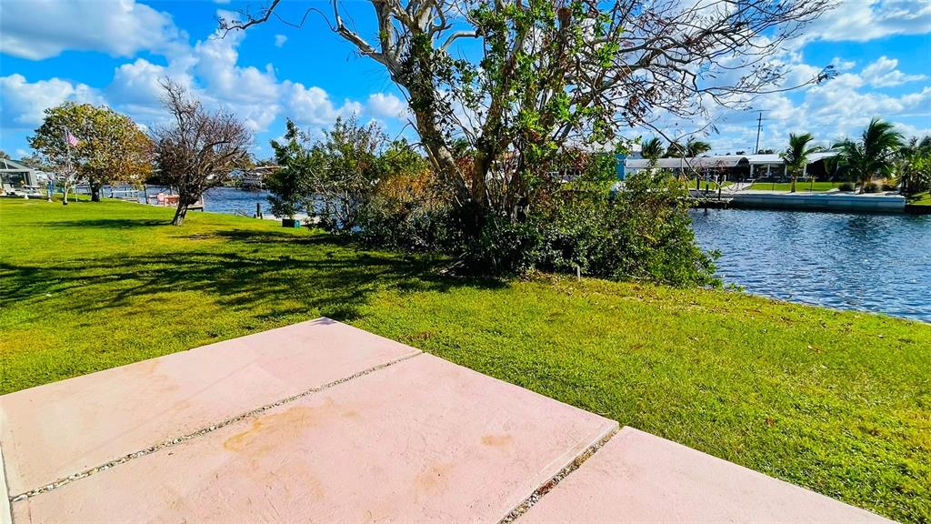 554 Lindley Terrace Port Charlotte, FL 33952 - Photo 51 of 57 a view of a lake with a building in the background