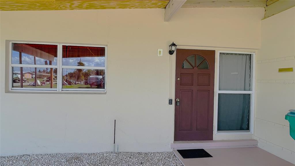 554 Lindley Terrace Port Charlotte, FL 33952 - Photo 9 of 57 a view of a hallway with paintings on the wall