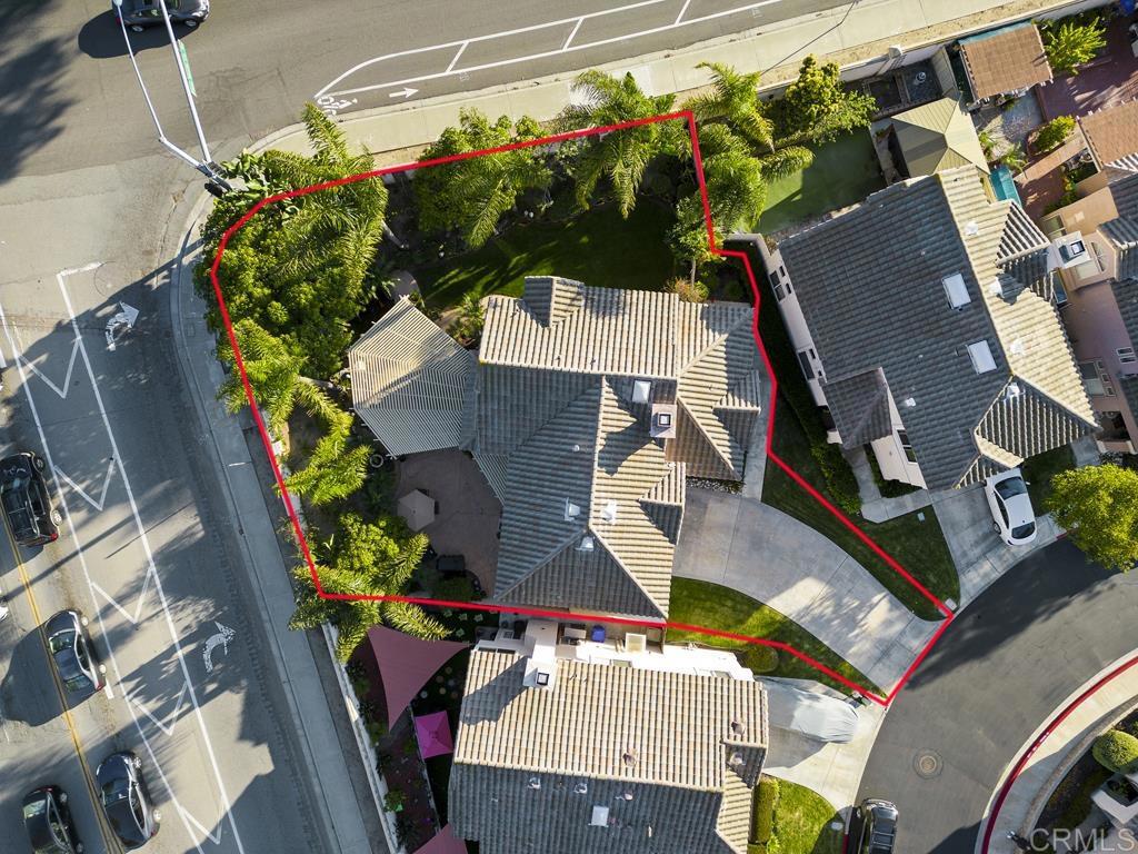 an aerial view of a house a garden and street view