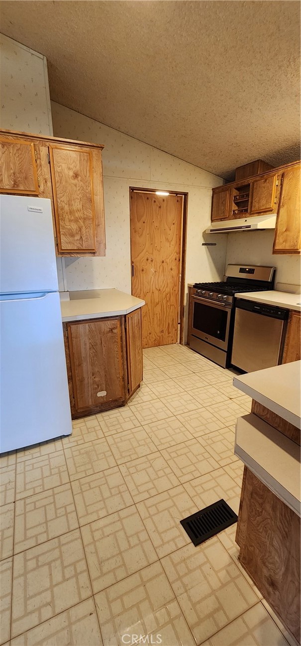 3589 West Wells Road, Unit 99 Blythe, CA 92225 - Photo 6 of 26 a bedroom with a bed and wooden floor