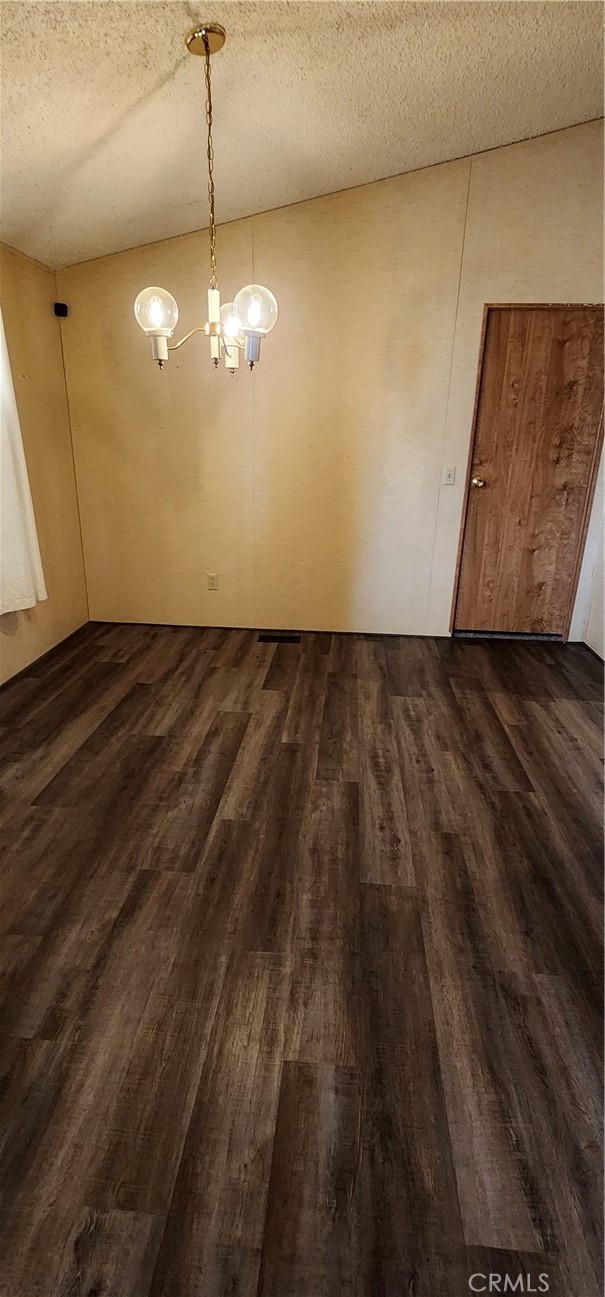 3589 West Wells Road, Unit 99 Blythe, CA 92225 - Photo 7 of 26 a view of a room with a ceiling fan and wooden floor