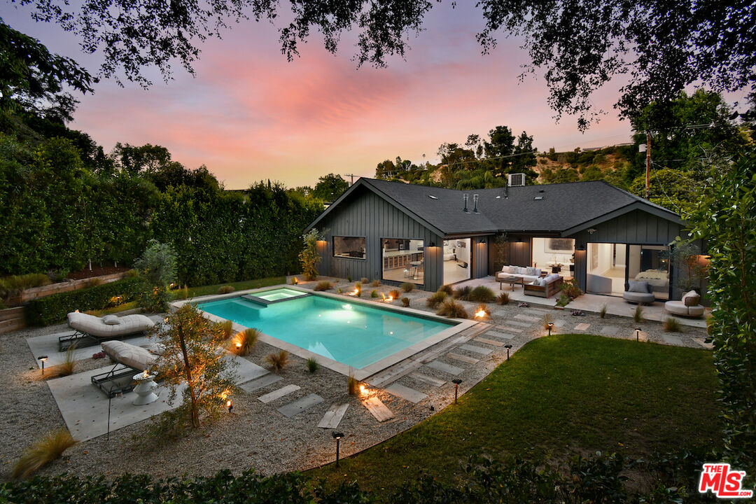3721 Woodcliff Road Sherman Oaks, CA 91403 - Photo 1 of 35 an aerial view of a house with swimming pool garden and patio