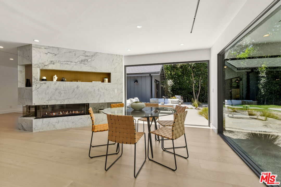 3721 Woodcliff Road Sherman Oaks, CA 91403 - Photo 15 of 35 a dining room with furniture and a large window