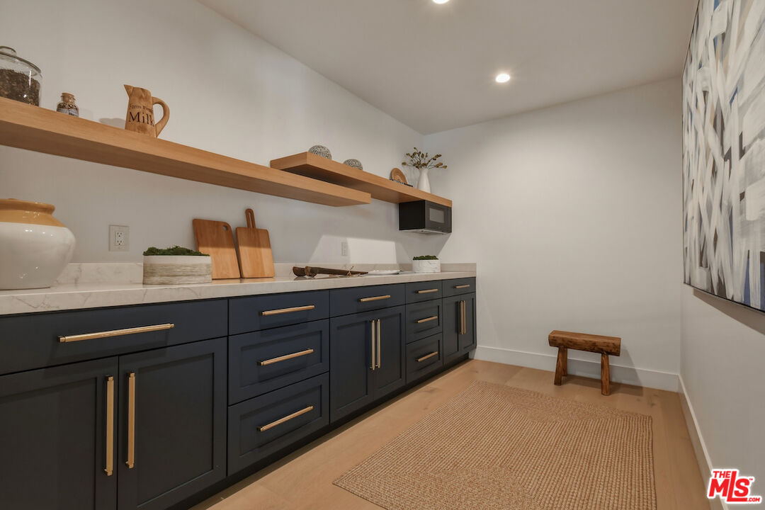 3721 Woodcliff Road Sherman Oaks, CA 91403 - Photo 17 of 35 a kitchen with sink and cabinets