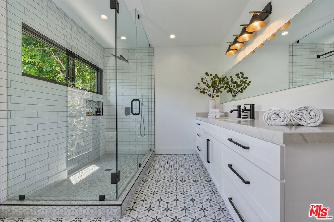 3721 Woodcliff Road Sherman Oaks, CA 91403 - Photo 23 of 35 a bathroom with a sink a toilet and shower