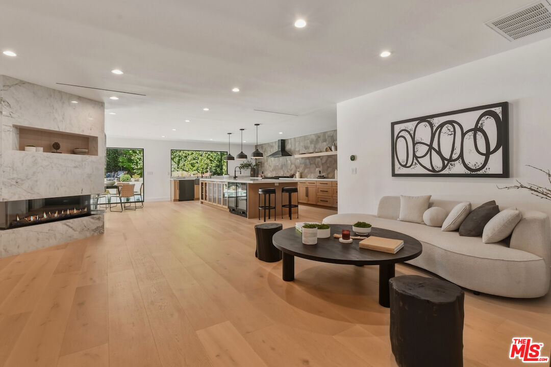3721 Woodcliff Road Sherman Oaks, CA 91403 - Photo 5 of 35 a living room with furniture and a table
