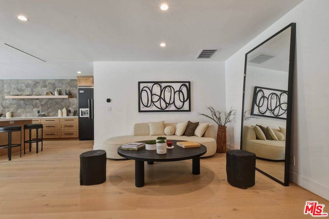 3721 Woodcliff Road Sherman Oaks, CA 91403 - Photo 6 of 35 a living room with furniture and a rug