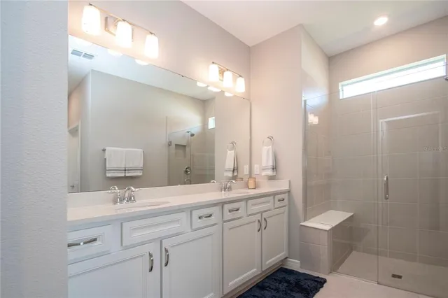 an aerial view of houses with a swimming pool