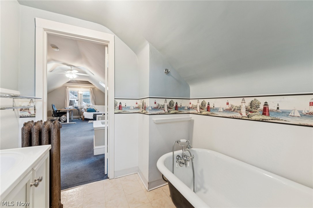 2925 East Overlook Road Cleveland Heights, OH 44118 - Photo 34 of 48 Bathroom featuring a classic clawfoot tub with chrome fixtures and a vanity with a white countertop