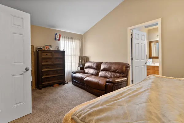 a bedroom with a bed and furniture