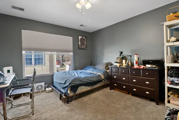 a bed room with furniture and a window