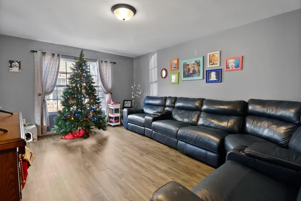 a living room with a couch and a window