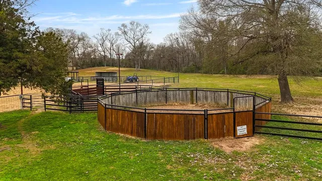 a view of a backyard with a large pool