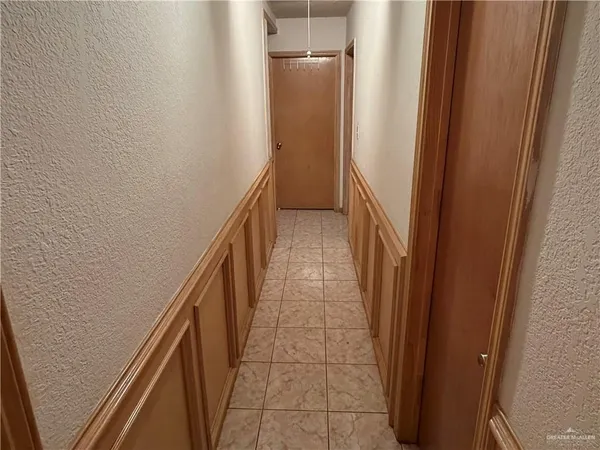 a kitchen with a refrigerator and a sink