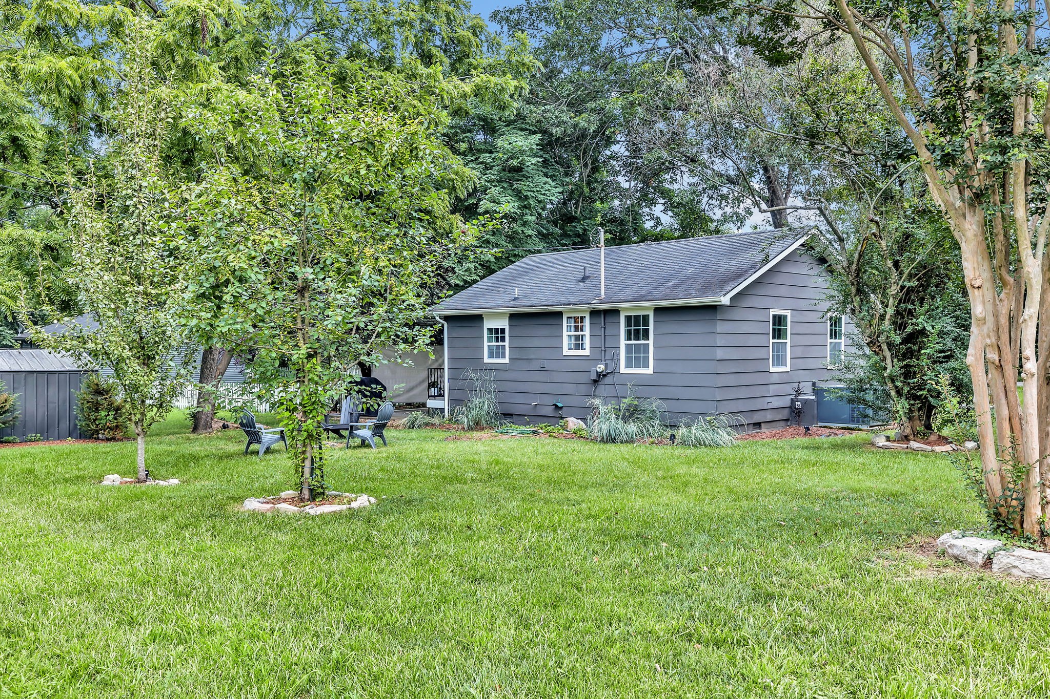124 Good Neighbors Road Franklin, TN 37064 - Photo 19 of 27 Backyard with mature trees and beautiful landscaping