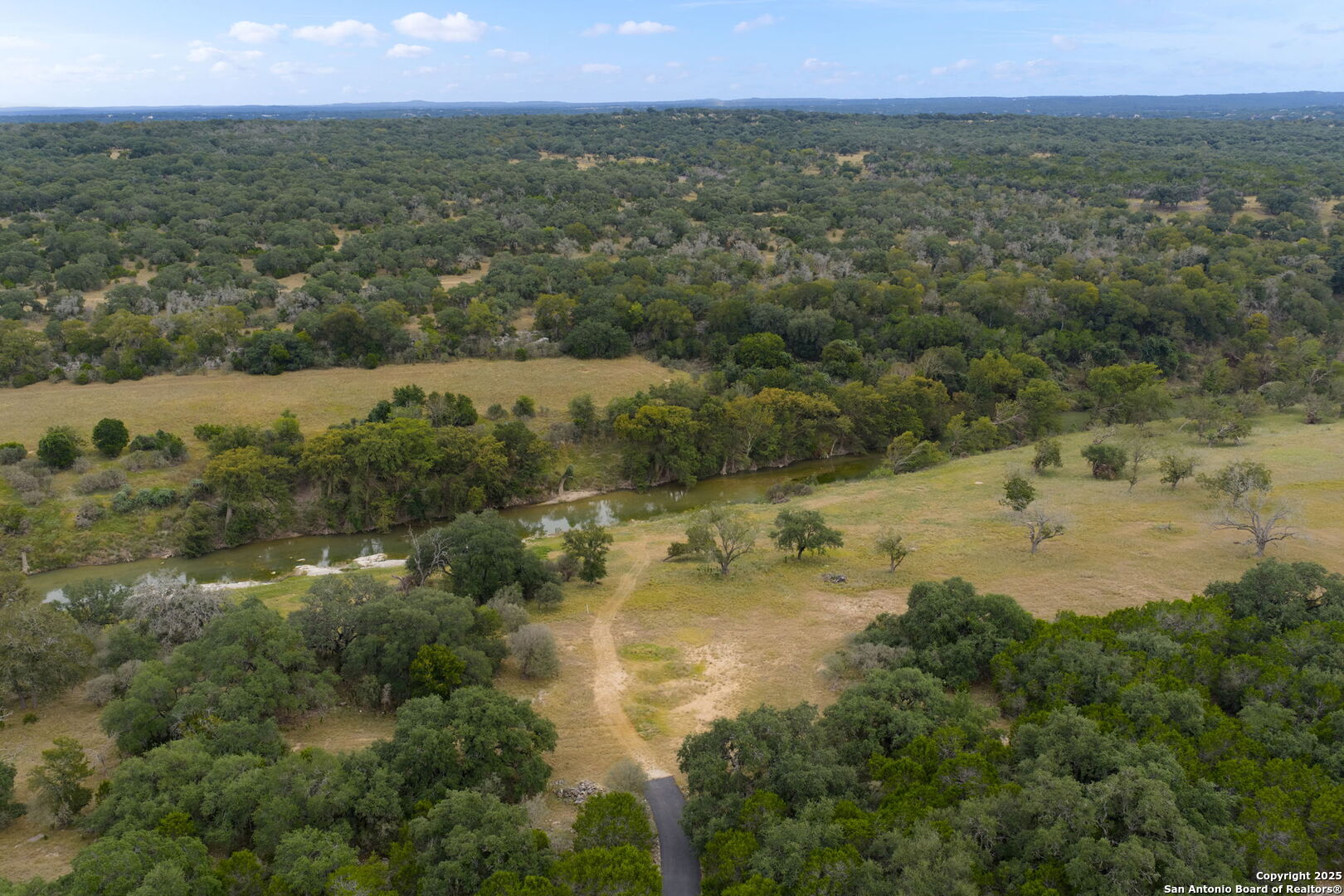 117 Clear Spring Drive Boerne, TX 78006 - Photo 13 of 54 a view of a lake with a city