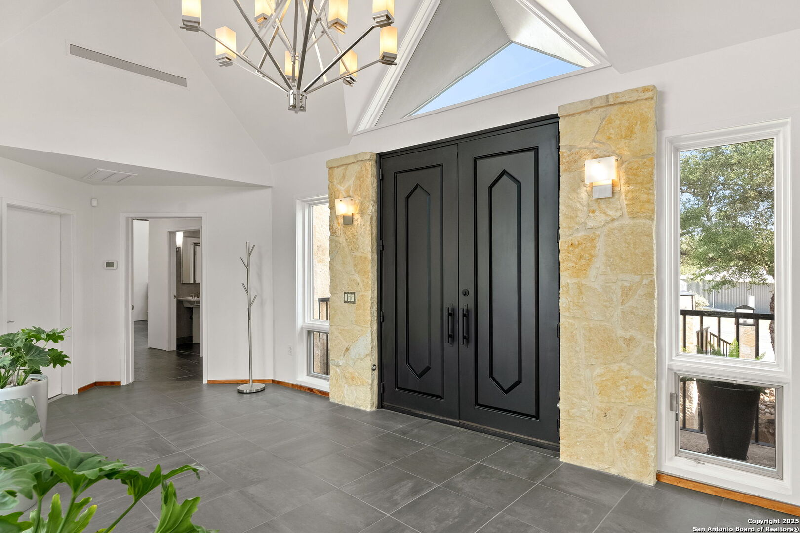 117 Clear Spring Drive Boerne, TX 78006 - Photo 19 of 54 a view of a hallway with wooden floor and a fireplace