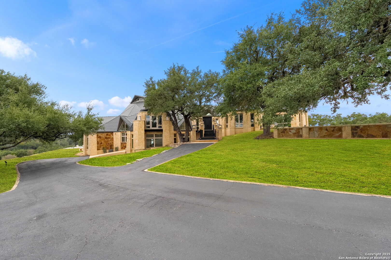 117 Clear Spring Drive Boerne, TX 78006 - Photo 2 of 54 a view of a house with basketball court