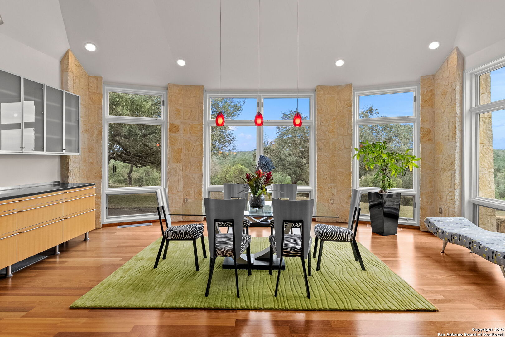 117 Clear Spring Drive Boerne, TX 78006 - Photo 27 of 54 a view of a dining room with furniture a rug and wooden floor
