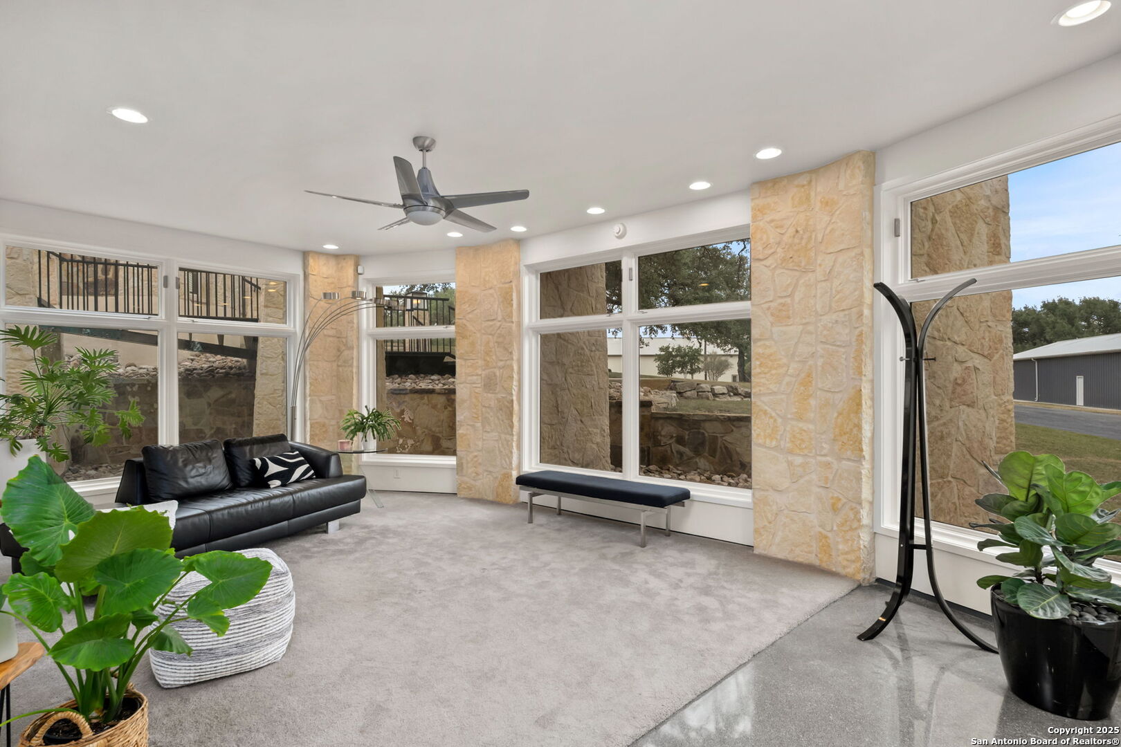 117 Clear Spring Drive Boerne, TX 78006 - Photo 31 of 54 a living room with furniture and potted plants