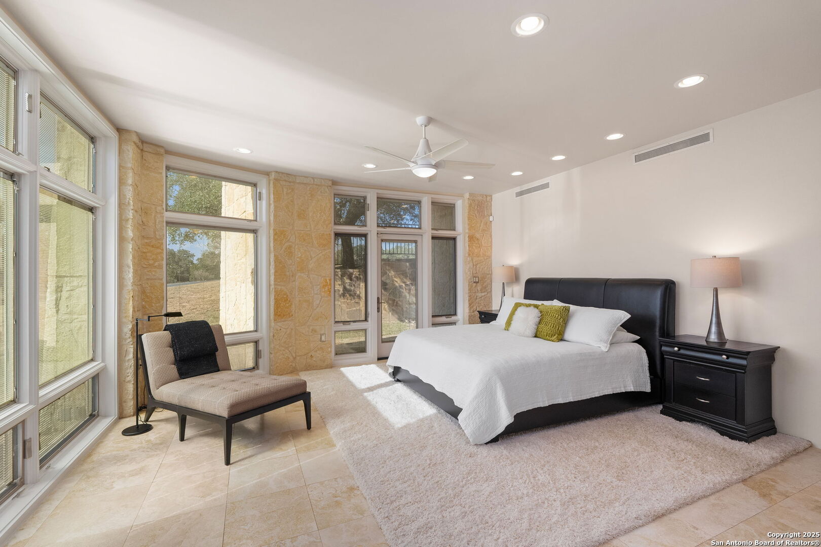 117 Clear Spring Drive Boerne, TX 78006 - Photo 32 of 54 a spacious bedroom with a bed and a couch