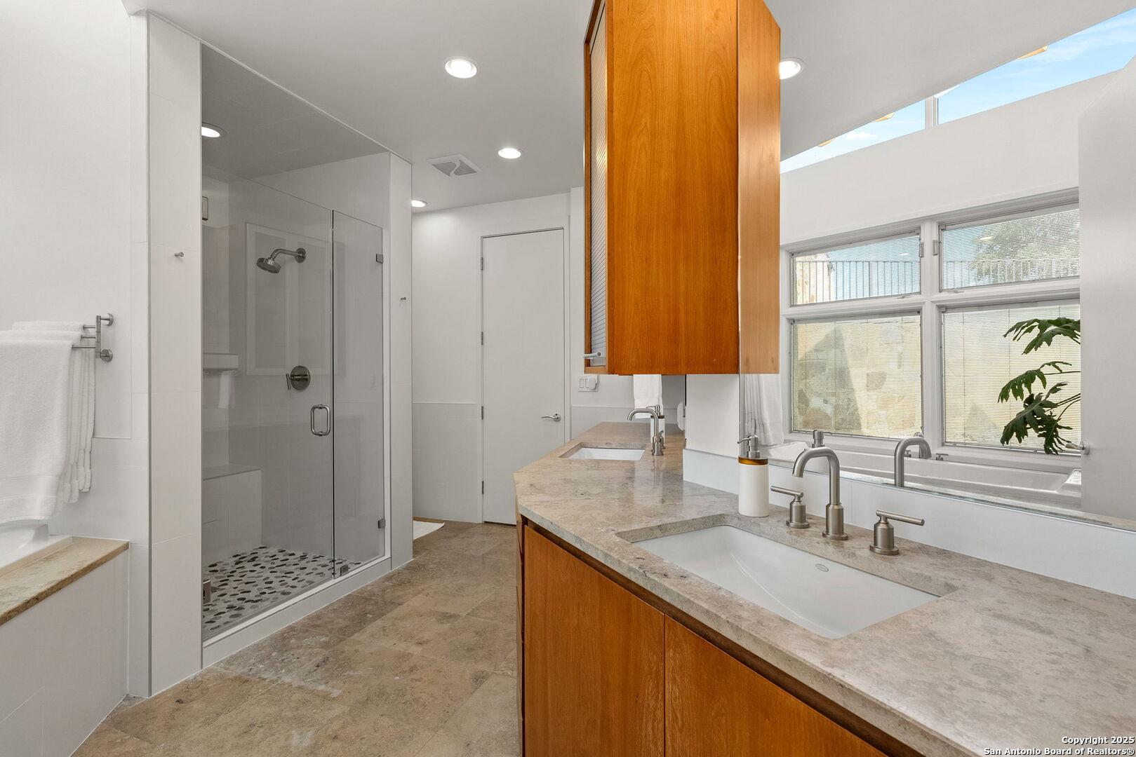 117 Clear Spring Drive Boerne, TX 78006 - Photo 35 of 54 a bathroom with a granite countertop sink and a mirror
