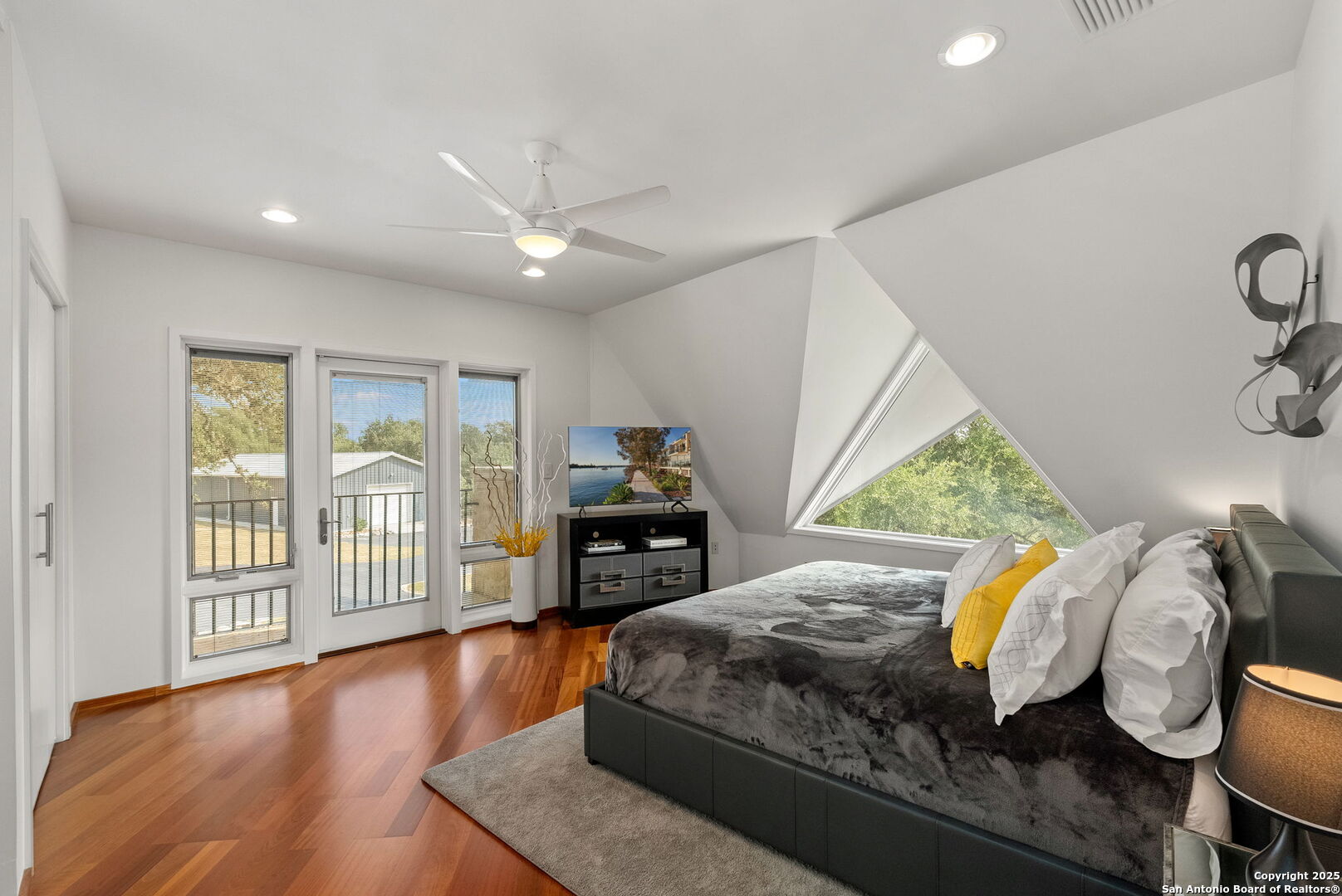 117 Clear Spring Drive Boerne, TX 78006 - Photo 38 of 54 a bedroom with furniture and a wooden floor