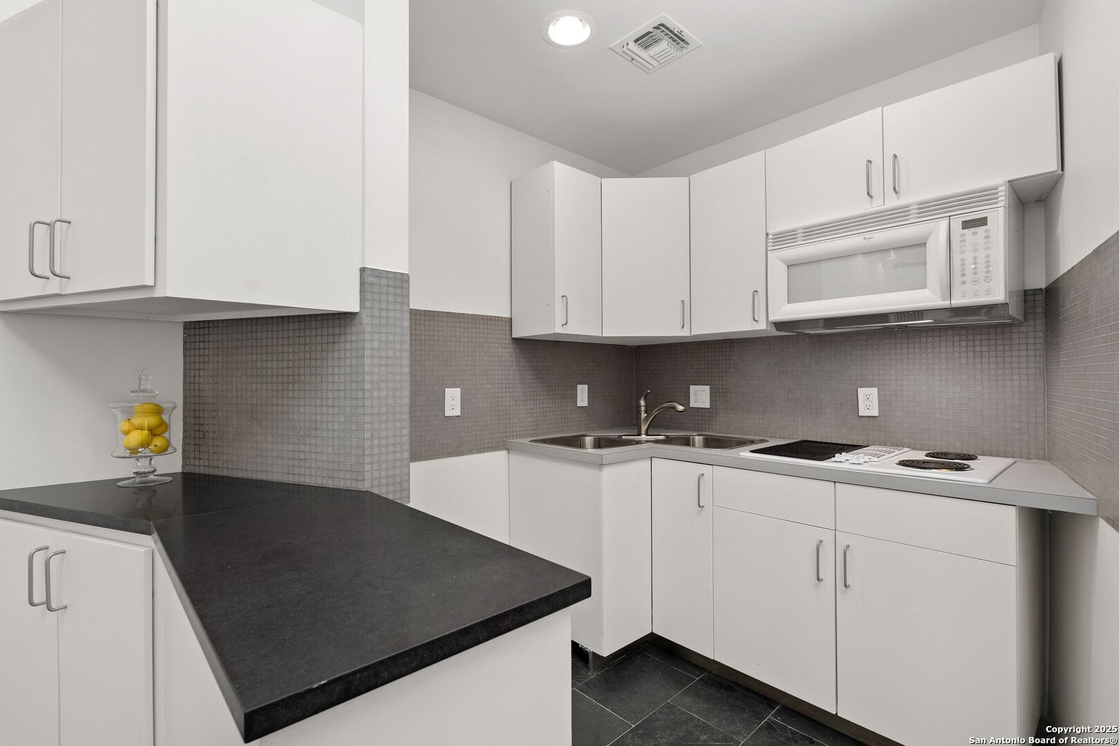117 Clear Spring Drive Boerne, TX 78006 - Photo 43 of 54 a kitchen with stainless steel appliances a sink a stove and cabinets