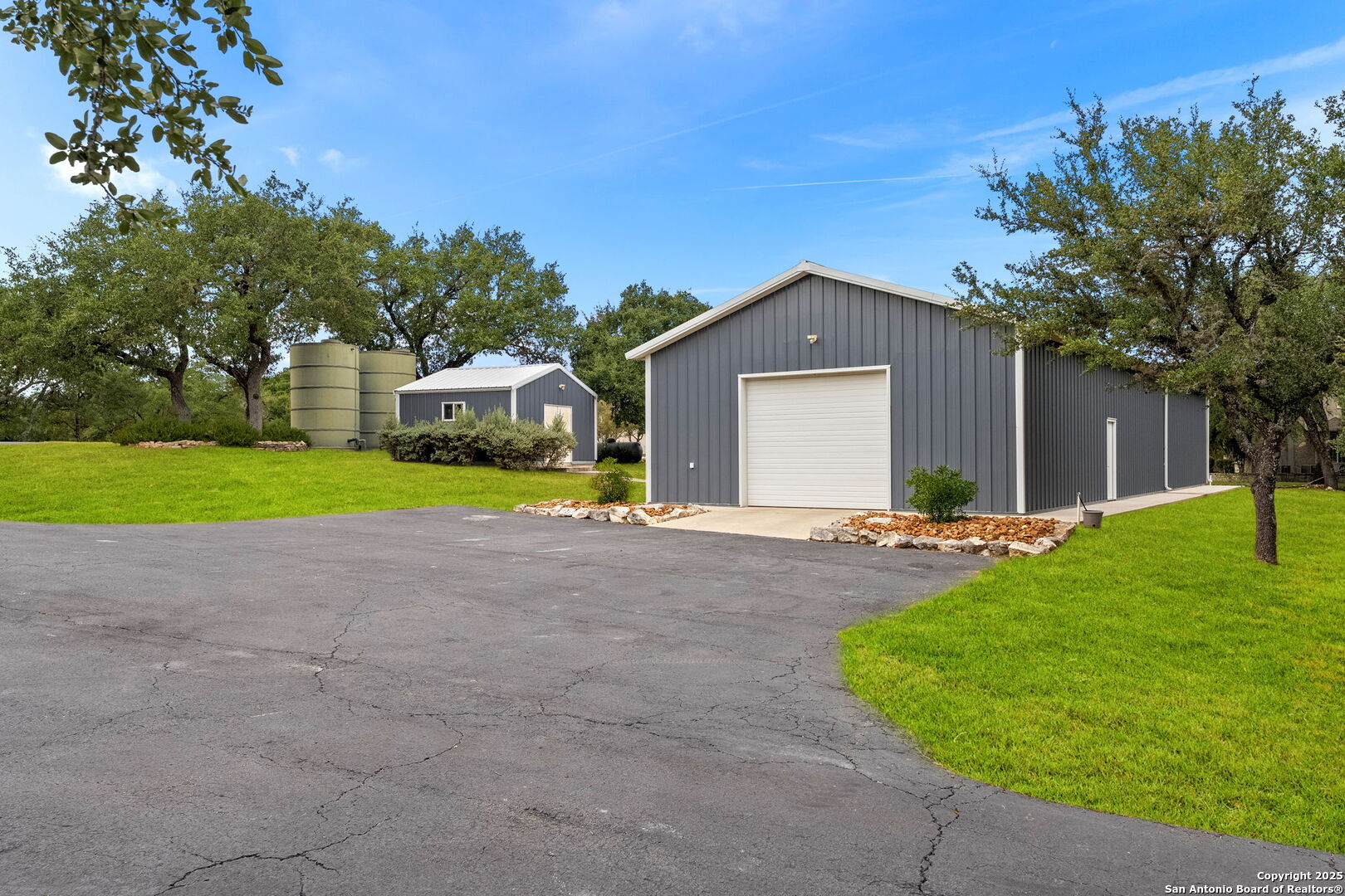 117 Clear Spring Drive Boerne, TX 78006 - Photo 5 of 54 a front view of a house with a yard and garage