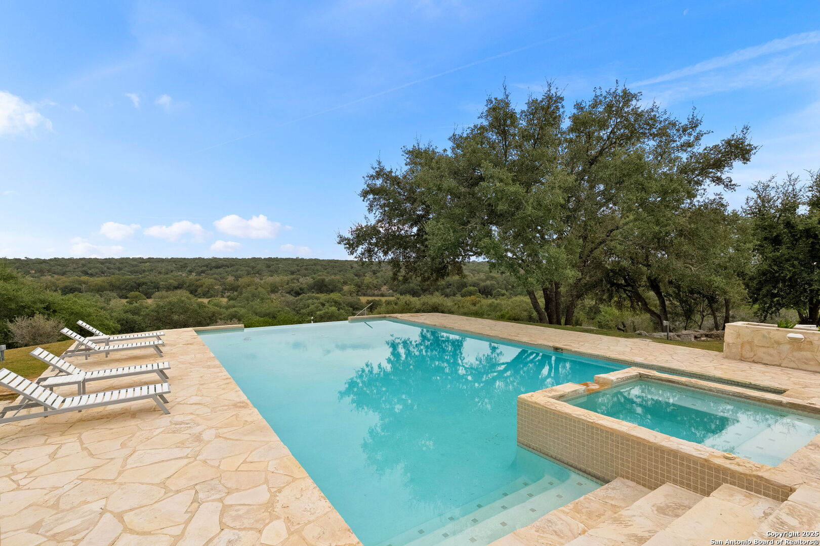 117 Clear Spring Drive Boerne, TX 78006 - Photo 8 of 54 a view of a swimming pool with a yard