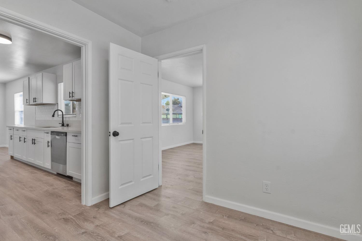 Undisclosed Address Bakersfield, CA 93304 - Photo 14 of 29 a view of a kitchen with white cabinets