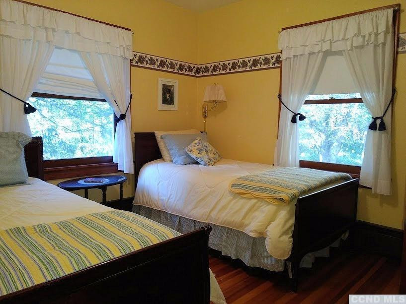 20 Hunt Road Hillsdale, NY 12529 - Photo 8 of 10 a bedroom with 2 bed and a window